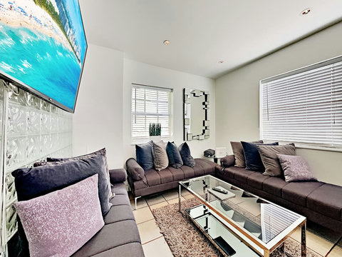 Experience comfort and entertainment in the inviting living room, boasting a U-shaped corner sofa, dining table, and a stunning 75 Inch Smart TV. Bond with your family/friends before venturing out to enjoy the lively activities of South Beach.