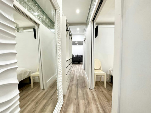 Rest in comfort! Discover a bedroom with memory foam mattresses, cozy dimmer lighting, USB chargers, Designer Mirrors, and Art Deco glass design.
