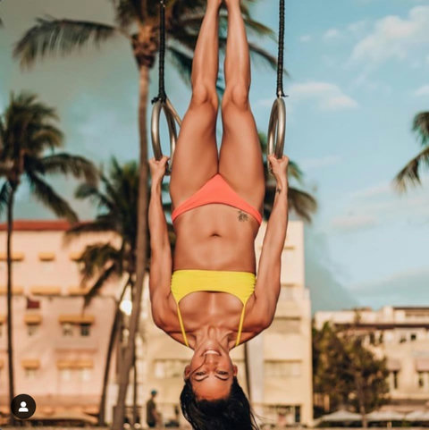 Welcome to our charming Casa Grande Suites building, adorned with Mediterranean-style clay tiles and cheerful yellow awnings, as seen in the background of this photo. The Beach Gym awaits right in front, courtesy of Muscle Beach South Beach.
