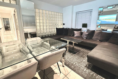 Experience comfort and entertainment in the inviting living room, boasting a U-shaped corner sofa, dining table, and a stunning 75 Inch Smart TV. Bond with your family/friends before venturing out to enjoy the lively activities of South Beach.
