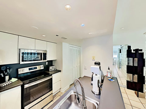 Indulge in our fully equipped kitchen featuring state-of-the-art Vitamix, Nespresso & Keurig Coffee Makers, Soda Stream, full-size stove, oven, microwave, fridge, dishwasher, and laundry machine with dryer.
