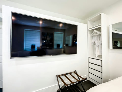 Your ultimate bedroom retreat! Enjoy a 70-inch Smart TV, comfortable memory foam mattresses, cozy dimmer lighting, USB chargers, and Designer Mirrors.