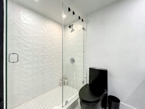 Your oasis of relaxation! Experience contemporary bathrooms with dimmer lights, double sink vanity, shower, & mirrored wall cabinets.