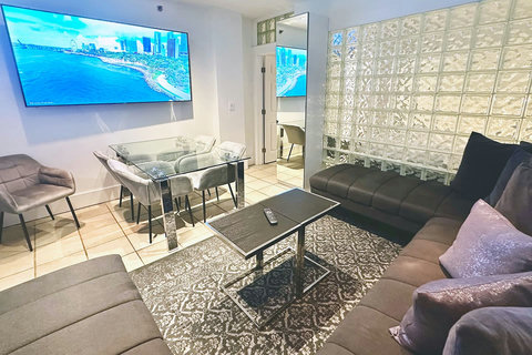 Experience comfort and entertainment in the inviting living room, boasting a U-shaped corner sofa, dining table, and a stunning 75 Inch Smart TV. Bond with your family/friends before venturing out to enjoy the lively activities of South Beach.
