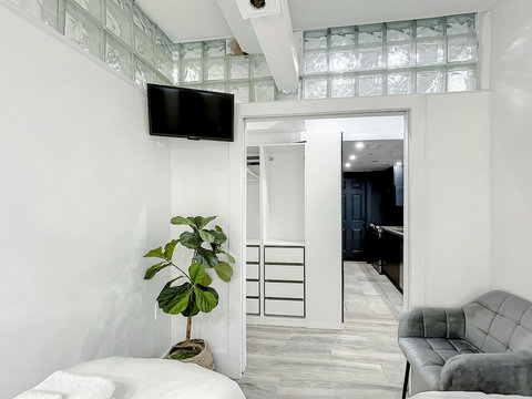 Rest in comfort! Discover a bedroom with memory foam mattresses, cozy dimmer lighting, USB chargers, Designer Mirrors, and Art Deco glass design.