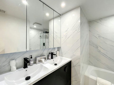 Your oasis of relaxation! Experience contemporary bathrooms with dimmer lights, double sink vanity, shower, & mirrored wall cabinets.
