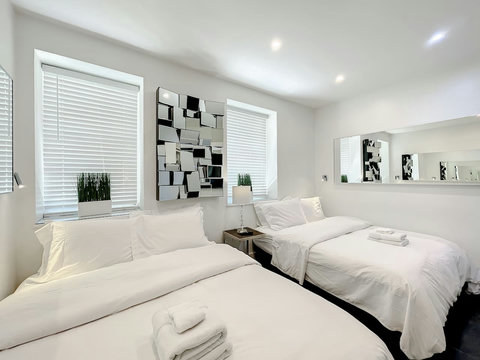 Your ultimate bedroom retreat! Enjoy a 70-inch Smart TV, comfortable memory foam mattresses, cozy dimmer lighting, USB chargers, and Designer Mirrors.