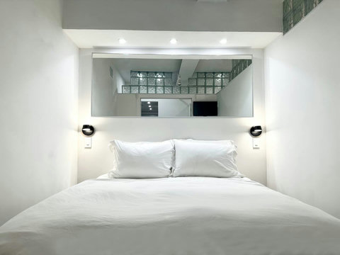 Rest in comfort! Discover a bedroom with memory foam mattresses, cozy dimmer lighting, USB chargers, Designer Mirrors, and Art Deco glass design.
