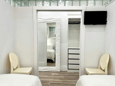 Rest in comfort! Discover a bedroom with memory foam mattresses, cozy dimmer lighting, USB chargers, Designer Mirrors, and Art Deco glass design.
