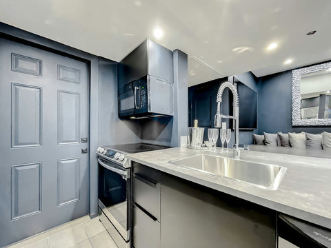 Enjoy Full-size kitchen with brand new Samsung stove, convection oven, air fryer, & island bar with in-kitchen dining. Entertain with 70-inch smart TV in the dining room, 50-inch in the kitchen, stone dining table for up to 12 persons & bar seating.
