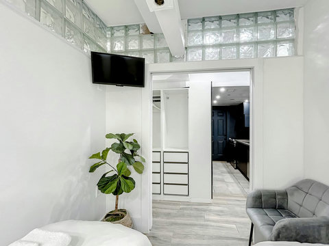 Rest in comfort! Discover a bedroom with memory foam mattresses, cozy dimmer lighting, USB chargers, Designer Mirrors, and Art Deco glass design.
