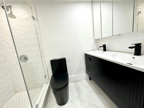 Your oasis of relaxation! Experience contemporary bathrooms with dimmer lights, double sink vanity, shower, & mirrored wall cabinets.
