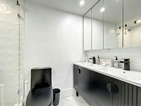 Your oasis of relaxation! Experience contemporary bathrooms with dimmer lights, double sink vanity, shower, & mirrored wall cabinets.
