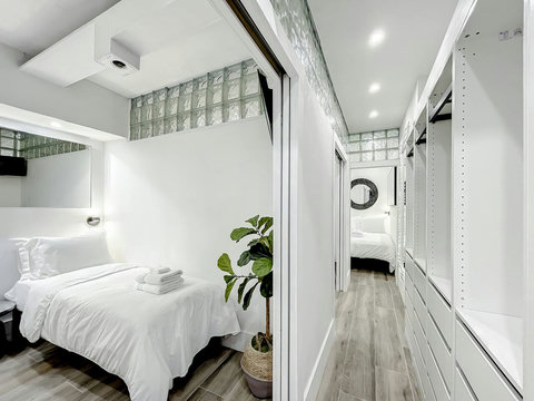 Rest in comfort! Discover a bedroom with memory foam mattresses, cozy dimmer lighting, USB chargers, Designer Mirrors, and Art Deco glass design.
