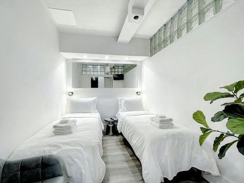 Rest in comfort! Discover a bedroom with memory foam mattresses, cozy dimmer lighting, USB chargers, Designer Mirrors, and Art Deco glass design.
