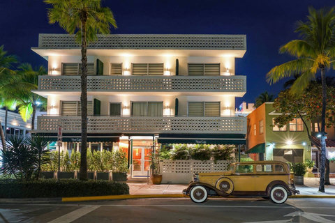 Step into luxury at Casa Grande Suite, perfectly located next to the iconic and classic News Cafe (as seen in this photo). Experience the best of Miami's beachfront living and indulge in city sophistication. Your dream getaway starts here! 