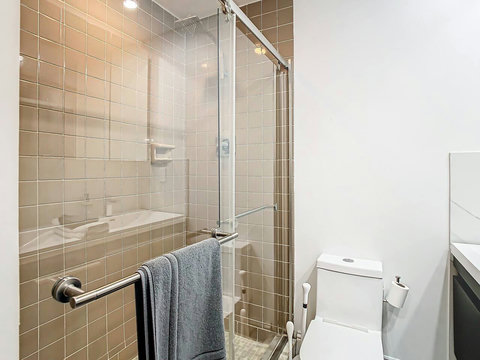 Bathroom with Standing Shower and Dual Sinks.