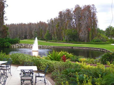 Scenic Patio Retreat - Enjoy our serene patio with a picturesque lake view overlooking the lush golf course.
