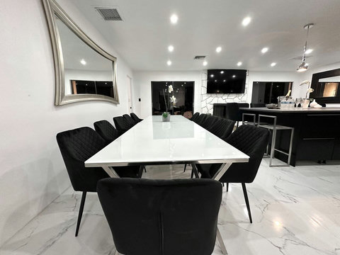 Gather around the cozy dining table, perfect for family meals or late-night conversations.