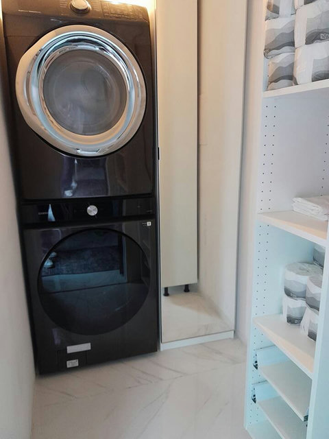 Laundry room with high efficiency washer and dryer.