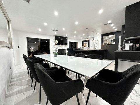 Gather around the cozy dining table, perfect for family meals or late-night conversations.