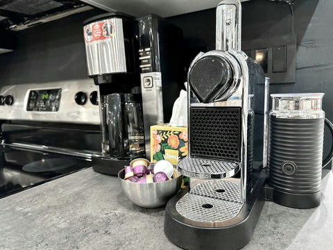 Enjoy the convenience of a Nespresso and Keurig Coffee Makers well as milk frother, providing a variety of coffee options to start your day right.
