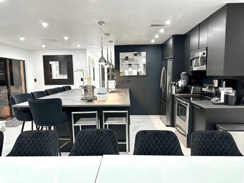 Open-plan kitchen and dining area with natural light and warm ambiance.