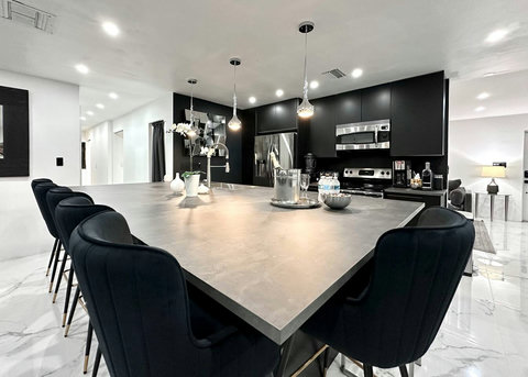 Open-plan kitchen and dining area with natural light and warm ambiance.