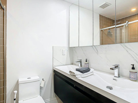 Bathroom with Standing Shower and Dual Sinks.