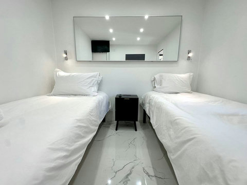 Bedroom #4: Flexible comfort with 1 king or 2 twin beds, a 26-inch plasma TV with cable, and a spacious closet for your essentials.