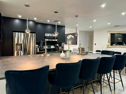 Open-plan kitchen and dining area with natural light and warm ambiance.