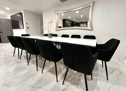 Gather around the cozy dining table, perfect for family meals or late-night conversations.