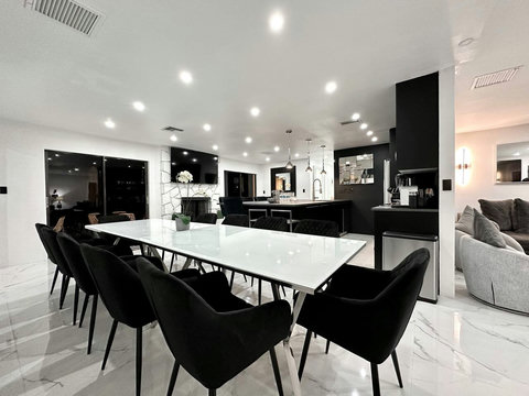 Gather around the cozy dining table, perfect for family meals or late-night conversations.