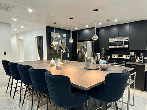 Open-plan kitchen and dining area with natural light and warm ambiance.