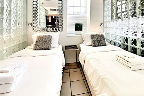 Ultimate Privacy - Retreat to Bedroom 3, a completely private space with floor-to-ceiling walls and door, offering the choice of 1 King or 2 Single beds.