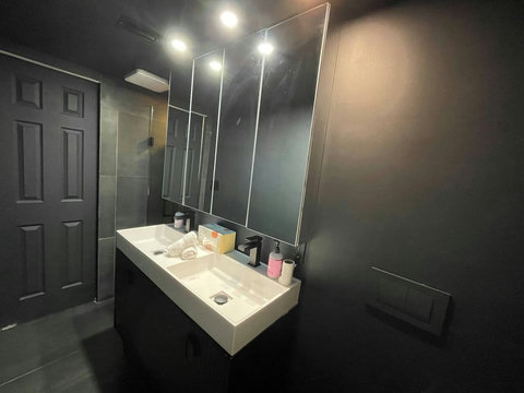 Experience modern luxury in Bathroom Nr 2, featuring a stand-alone shower and dual sinks for a sleek and contemporary bathing experience.
