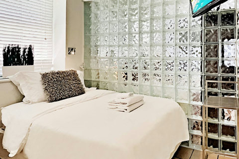 Ultimate Privacy - Experience complete seclusion in Bedroom Nr 2 with floor-to-ceiling walls and door, offering the choice of 1 King or 2 single beds.