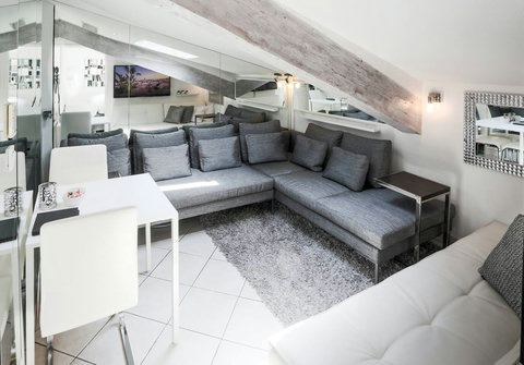 Experience the perfect blend of comfort and functionality in our living room, complete with a stylish kitchen table and chairs. 