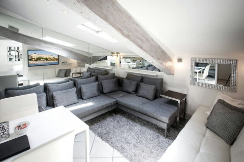 Relax in style in our spacious living room, featuring a comfortable sofa group and an additional bed for your ultimate comfort.