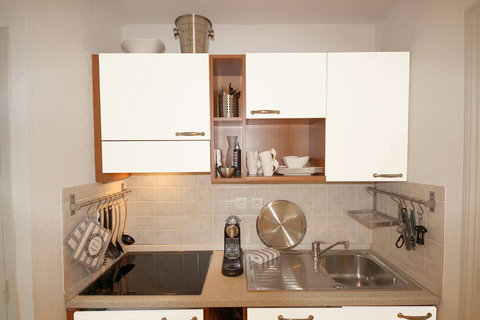 Discover culinary delights in our fully equipped kitchen. Whip up delicious meals and enjoy a seamless cooking experience during your stay.
