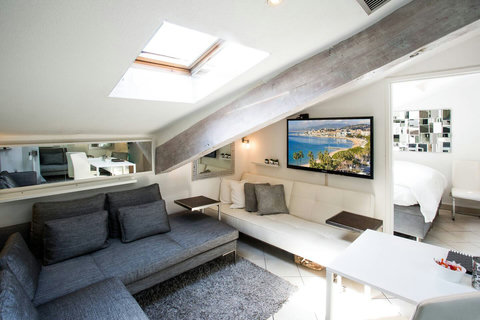 Relax in style in our spacious living room, featuring a comfortable sofa group for your ultimate comfort.