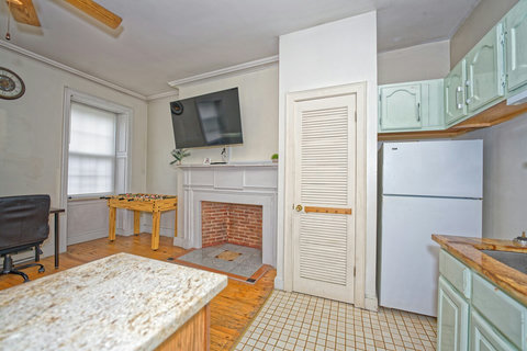 Kitchen with breakfast bar and granite countertops