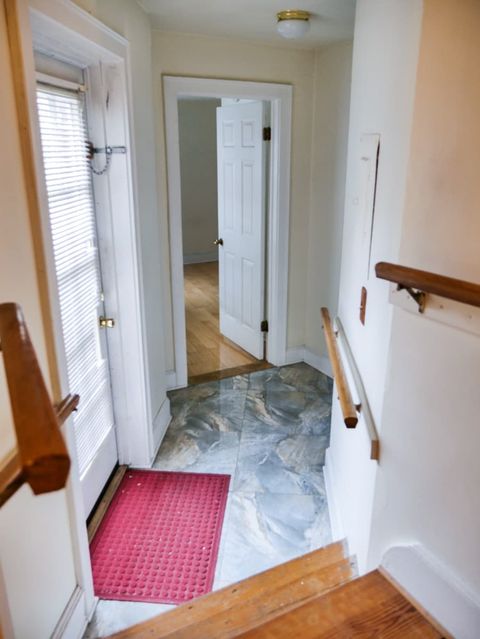 Rear hallway to bathroom, 2nd bedroom, and rear deck