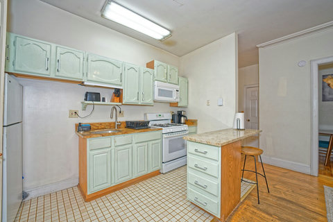 Kitchen with breakfast bar and granite countertops