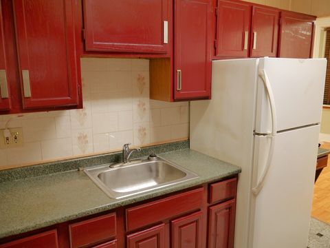 Kitchen (opposite the oven and cooktop)