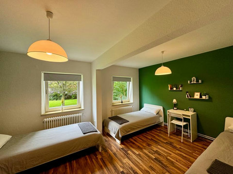 3 single beds in bedroom 1