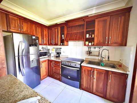 Kitchen: refrigerator, stove, oven, microwave, coffee maker, kitchen utensils.
