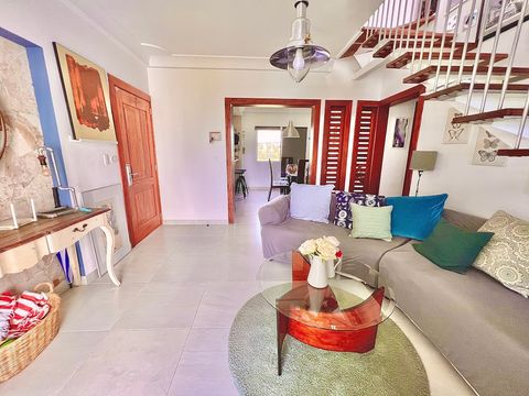 living room,  view of the dining room and view of the front door entrance