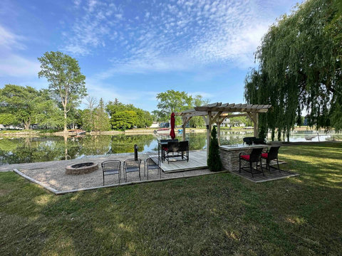 The dockside patio and firepit area allows for entertaining and relaxation. Wave to the boaters as they pass slowly in the summertime, or simply enjoy the sun and view.