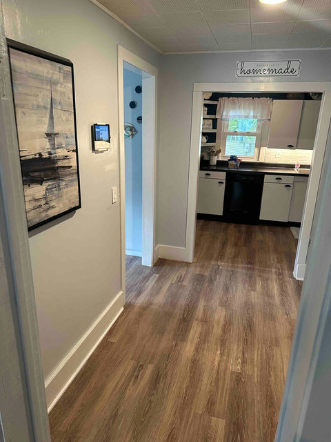 The coffee bar area features a wall-mounted iPad home controller featuring management of the Philips hue lighting, furnace/temperature sensors, and ability to stream Apple Music to the living room TV sound system or master bedroom Roku. 